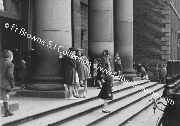 GARDINER STREET PEOPLE LEAVING ST F.X.CHURCH